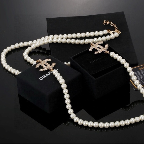 CHANEL Jewelry - CHANEL White Pearl Necklace with Gold Logo